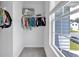 Bright walk-in closet with shelving, vinyl flooring, and a window offering natural light at 600 Tudor St, Kingston, GA 30145