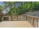 Outdoor deck with wood fence offers a private setting surrounded by lush greenery at 1536 Liberty Nw Pkwy, Atlanta, GA 30318