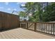 Outdoor deck with wood fence offers a private setting surrounded by lush greenery at 1536 Liberty Nw Pkwy, Atlanta, GA 30318