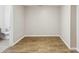 Unfurnished basement space with light gray walls, a faux wood-grain tile floor and a bathroom at 1536 Liberty Nw Pkwy, Atlanta, GA 30318