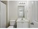 Bathroom featuring a toilet, vanity with storage and mirror, and a shower with curtain at 1536 Liberty Nw Pkwy, Atlanta, GA 30318