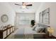 Well-lit bedroom featuring neutral tones, decorative accents, and ample natural light at 1536 Liberty Nw Pkwy, Atlanta, GA 30318