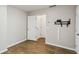 Unfurnished bedroom space with light gray walls, and a faux wood-grain tile floor at 1536 Liberty Nw Pkwy, Atlanta, GA 30318