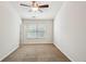 Bedroom with neutral carpet, ceiling fan, and window providing natural light at 1536 Liberty Nw Pkwy, Atlanta, GA 30318