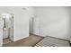 The bedroom has neutral carpet, white walls and two entry doors at 1536 Liberty Nw Pkwy, Atlanta, GA 30318