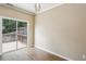 Bright bedroom features a sliding glass door leading to an outdoor deck and wood floors at 1536 Liberty Nw Pkwy, Atlanta, GA 30318