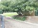 Dog park featuring mature shade tree with a grassy area surrounded by a fence at 1536 Liberty Nw Pkwy, Atlanta, GA 30318