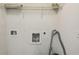Laundry room with washer-dryer hookups, overhead rack, and white painted walls at 1536 Liberty Nw Pkwy, Atlanta, GA 30318