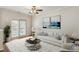 Bright living room with neutral tones, a ceiling fan, and a private balcony at 1536 Liberty Nw Pkwy, Atlanta, GA 30318