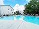 Community pool with lounge chairs and umbrellas for residents' enjoyment on a sunny day at 1536 Liberty Nw Pkwy, Atlanta, GA 30318