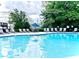 Community pool with lounge chairs and umbrellas for residents' enjoyment on a sunny day at 1536 Liberty Nw Pkwy, Atlanta, GA 30318