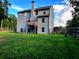 The spacious backyard features a well-maintained lawn and a charming wooden fence at 17 Kola Ln, Rydal, GA 30171