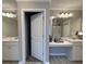 Bathroom showcasing dual sinks, vanity area, and a tub with shower curtain at 17 Kola Ln, Rydal, GA 30171