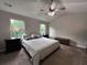Spacious bedroom with ceiling fan, and natural light from the large windows at 17 Kola Ln, Rydal, GA 30171