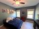 This bedroom features a ceiling fan, natural light and stylish artwork on the walls at 17 Kola Ln, Rydal, GA 30171