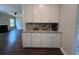Butler's pantry features built-in cabinets, granite counters, and coffee bar with appliances at 17 Kola Ln, Rydal, GA 30171