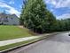 View of the home and its surroundings, showcasing the landscaping and neighborhood at 17 Kola Ln, Rydal, GA 30171