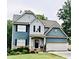 Charming two-story home with attached garage, manicured lawn, and inviting front entrance at 17 Kola Ln, Rydal, GA 30171