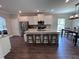 Bright kitchen features granite counters, stainless appliances, and a kitchen island with seating at 17 Kola Ln, Rydal, GA 30171