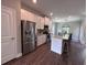 Bright kitchen features granite counters, stainless appliances, and a kitchen island with seating at 17 Kola Ln, Rydal, GA 30171