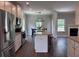 Bright kitchen overlooks the breakfast area and living room with cozy fireplace at 17 Kola Ln, Rydal, GA 30171