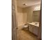 Clean bathroom featuring a shower-tub combination and a vanity with white cabinets at 2191 Rockbridge Road # 2603, Stone Mountain, GA 30087