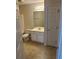 Bathroom featuring tile flooring, a toilet, and a vanity with a mirror at 2191 Rockbridge Road # 2603, Stone Mountain, GA 30087