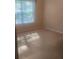 Simple bedroom with a neutral carpet and ample natural light from the window at 2191 Rockbridge Road # 2603, Stone Mountain, GA 30087