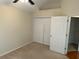 Bedroom featuring double closet and neutral carpet at 2191 Rockbridge Road # 2603, Stone Mountain, GA 30087