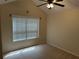 Bedroom featuring large window with blinds at 2191 Rockbridge Road # 2603, Stone Mountain, GA 30087