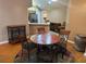 Cozy dining area with wooden table and decorative rug. Ready for Gathering gatherings at 2191 Rockbridge Road # 2603, Stone Mountain, GA 30087