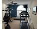 Well-equipped exercise room with natural light and ceiling fan at 2191 Rockbridge Road # 2603, Stone Mountain, GA 30087
