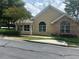 Charming property featuring a partial stone facade, manicured greenery, and a sidewalk, set on a peaceful residential street at 2191 Rockbridge Road # 2603, Stone Mountain, GA 30087