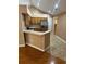 Kitchen features stainless steel appliances, light wood cabinets, and breakfast bar at 2191 Rockbridge Road # 2603, Stone Mountain, GA 30087