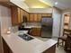 Open kitchen featuring stainless steel appliances, ample counter space and cabinetry at 2191 Rockbridge Road # 2603, Stone Mountain, GA 30087
