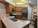 Well-lit kitchen with stainless steel appliances and ample counter space at 2191 Rockbridge Road # 2603, Stone Mountain, GA 30087