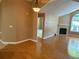 Inviting living room featuring hardwood floors, fireplace, and natural light from a beautiful window at 2191 Rockbridge Road # 2603, Stone Mountain, GA 30087
