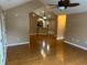 Open-concept living area showcases hardwood floors and adjoining kitchen at 2191 Rockbridge Road # 2603, Stone Mountain, GA 30087