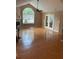 Open living room with hardwood floors, a fireplace, and French doors at 2191 Rockbridge Road # 2603, Stone Mountain, GA 30087