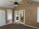Comfortable sunroom featuring a ceiling fan and access to patio via french doors at 2191 Rockbridge Road # 2603, Stone Mountain, GA 30087