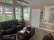 Comfortable sunroom with large windows, a ceiling fan, and cozy furniture at 2191 Rockbridge Road # 2603, Stone Mountain, GA 30087