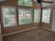 Well-lit sunroom with multiple windows overlooking the landscaped yard at 2191 Rockbridge Road # 2603, Stone Mountain, GA 30087