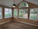 Bright sunroom with neutral walls, carpet flooring and multiple windows providing ample natural light at 2191 Rockbridge Road # 2603, Stone Mountain, GA 30087