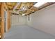 Unfinished basement area with cement block walls, gray floor, and exposed ceiling at 225 Hitchcock Dr, Villa Rica, GA 30180