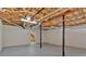 Unfinished basement space with ceiling pipes and exposed wooden beams offering a blank canvas at 225 Hitchcock Dr, Villa Rica, GA 30180