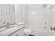 This bathroom features a tub, shower, and vanity with stone countertops at 225 Hitchcock Dr, Villa Rica, GA 30180