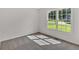 Bedroom with large windows and carpeted floors at 225 Hitchcock Dr, Villa Rica, GA 30180