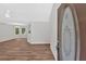 Entryway featuring hardwood floors, neutral walls, and a decorative glass front door, with a view of the living space at 225 Hitchcock Dr, Villa Rica, GA 30180