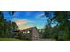 The home's exterior features a two-car garage and charming deck with stairs, set against a backdrop of lush greenery at 225 Hitchcock Dr, Villa Rica, GA 30180
