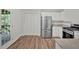 The kitchen features modern appliances, hardwood floors, and exterior access to a deck at 225 Hitchcock Dr, Villa Rica, GA 30180
